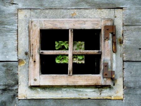 two consecutive windows in a wooden cabinの写真素材
