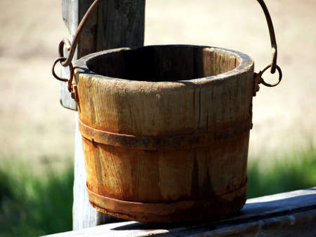 Wooden bucket in a well sweepの写真素材