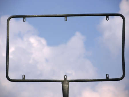 blank billboard against blue sky and cloudsの写真素材