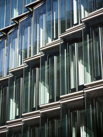 facade of a berlin office building with many windowsの写真素材