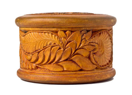 Round wooden box decorated with carvingsの写真素材