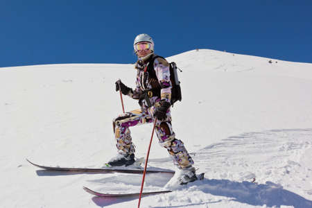 Woman skier in soft snowの写真素材