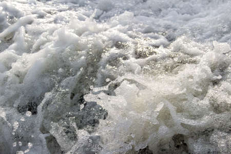 Water foam sunlit close-upの写真素材