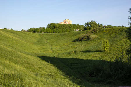 Footpath in a green park on the hillsideの写真素材