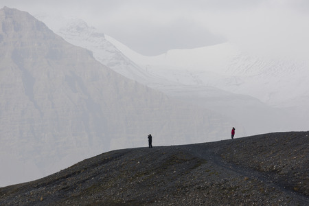 Jokulsarlon, Iceland, November 2nd, 2014, two tourists above the Jokulsarlon Glacial Lagoon, Vatnajokull, EDITORIALのeditorial素材