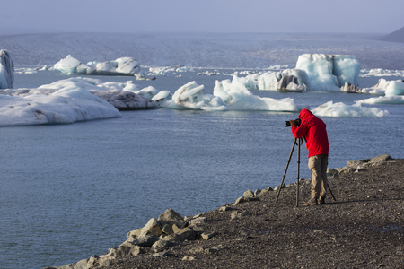 Jokulsarlon, Iceland, November 2nd, 2014, Photographer at Jokulsarlon Glacial Lagoon, Vatnajokull, EDITORIALのeditorial素材