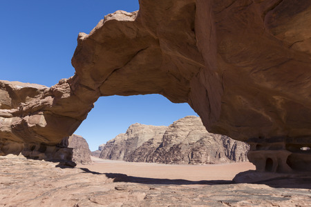 natural rock bridge and panoramic view of Wadi Rum desert, Jordanの写真素材