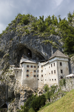 Postojna, Slovenia - July 11 2017: Predjama; Castle at the cave mouth in Postojna, Slovenia in springtimeのeditorial素材