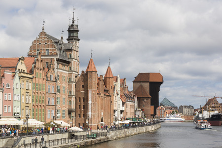 Danzig, Poland - July 7 2016: Gdansk old city in Poland with the oldest medieval port crane (Zuraw) in Europe and a promenade along the riverbank of Motlawa Riverのeditorial素材