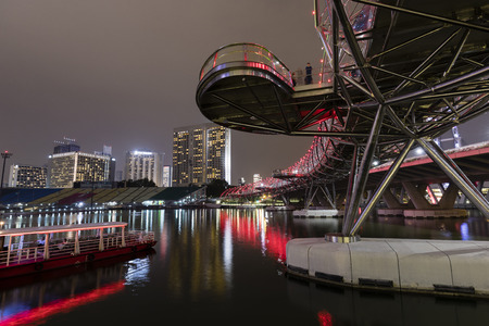 SINGAPORE, December 10, 2017: The Helix Bridge at night in Singapore. The Helix is fabricated from 650 tonnes of Duplex Stainless Steel and 1000 tonnes of carbon steel.のeditorial素材
