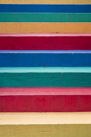 Stairs painted in rainbow colors backgroundの写真素材