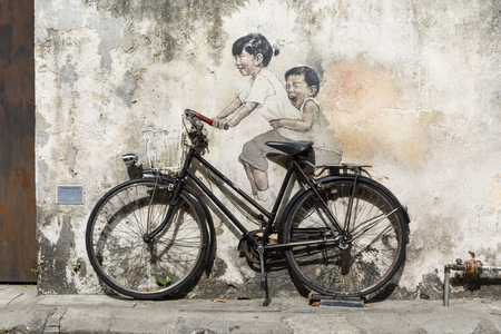 George Town, Penang, Malaysia, December 19 2017: "Little Children on a Bicycle" street art mural by Lithuanian artist Ernest Zacharevic in Georgetown, Penang, Malaysiaのeditorial素材