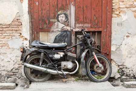 George Town, Penang, Malaysia, December 19 2017: "Boy on a Bike" street art painted by Ernest Zacharevic in Penangのeditorial素材