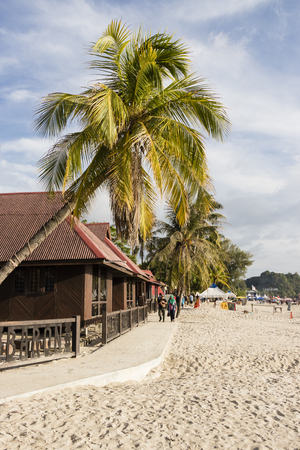 Langkawi, Malaysia, December 21 2017: Beautiful beach of Langkawi with a bungalow and palm trees during the middayのeditorial素材