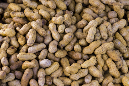 Over steam roasted peanuts on a marketの写真素材