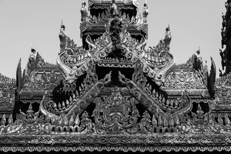 Detail of a wooden temple with beautiful carvings in Bagan, Myanmarの写真素材
