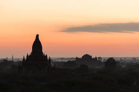 Silhouette of the ancient temples in the archaeological park in Bagan before the sunrise, Myanmarの写真素材