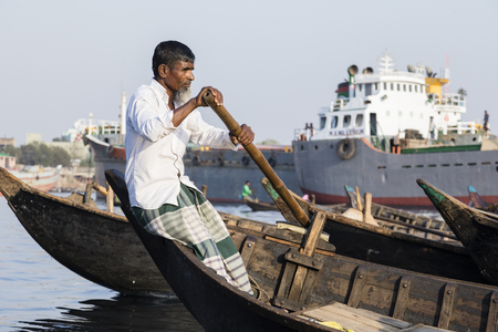 Dhaka, Bangladesh, February 24 2017: Close-up view of a rudder in a taxi boat from the perspective of the passenger on the Buriganga River in Dhaka Bangladeshのeditorial素材