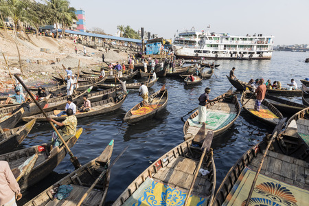 Dhaka, Bangladesh, February 24 2017: Small rowboats are waiting for passengers on the banks of the...