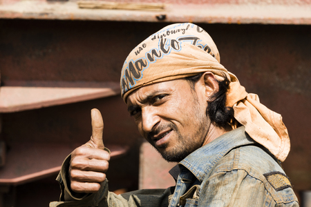 Dhaka, Bangladesh, February 24 2017: A worker at a shipyard in Dhaka Bangladesh shows his thumbs upのeditorial素材