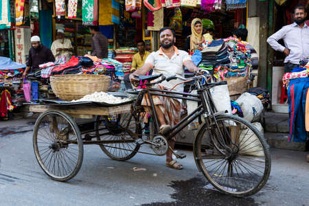 Khulna, Bangladesh, February 28 2017: Trishaw rider proudly posing in the shopping street of Khulnaのeditorial素材