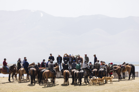 Song Kul, Kyrgyzstan, August 8 2018: Many Kyrgyz people meet with their horses at Song Kul Lake in Kyrgyzstan for a debateのeditorial素材