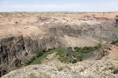 Beautiful view of the Charyn Canyon in the Almaty region of Kazakhstan with its reddish sandstone cliffsの写真素材