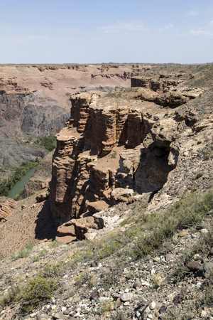 Beautiful view of the Charyn Canyon in the Almaty region of Kazakhstan with its reddish sandstone cliffsの写真素材