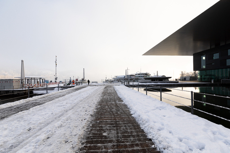 Lucerne, Switzerland, February 4, 2019: The culture and congress center (KKL) in Lucerne with a snowy footpath on a cold winter morningのeditorial素材
