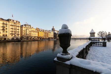 Lucerne, Switzerland, February 4, 2019: Old town of Lucerne with reuss river and water tower on a cold winter morning during sunriseのeditorial素材