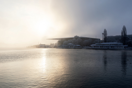 Lucerne, Switzerland, February 4, 2019: Lake Lucerne with the cultural and congress center (KKL) and dock on a mystical winter morning in Lucerneのeditorial素材