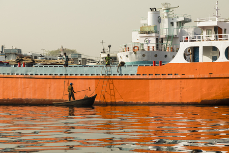 Dhaka, Bangladesh, February 24 2017: Maler attaches the rust protection on a ship in Dhaka Bangladesh to a shipのeditorial素材