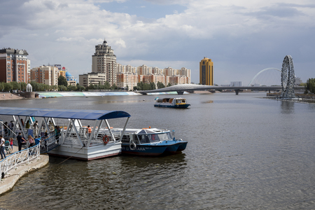 Astana, Kazakhstan, August 4 2018: Landing point for the excursion boats on the Yesil River in downtown Astanaのeditorial素材