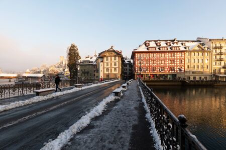 Lucerne, Switzerland, February 4, 2019: Old town of Lucerne with reuss river on a cold winter morning during sunriseのeditorial素材