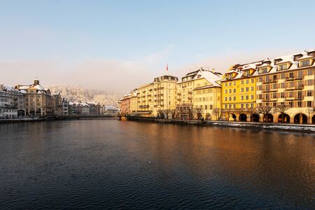 Lucerne, Switzerland, February 4, 2019: Old town of Lucerne with reuss river on a cold winter morning during sunriseのeditorial素材