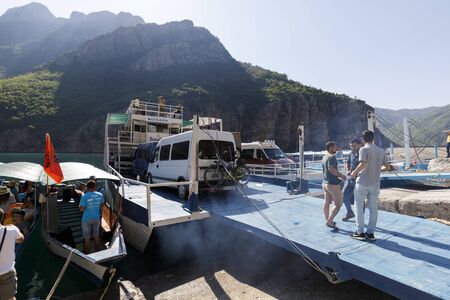 Koman, Albania, July 7 2019: Ferry is loaded with cars and passengers in Koman, Komani lake, a 35km long reservoir in the dinaric alpsのeditorial素材