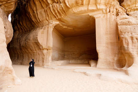 Al Ula, Saudi Arabia, February 19 2020: Tourist inside the Siq of Jabal Ithlib in Al Ula, KSA