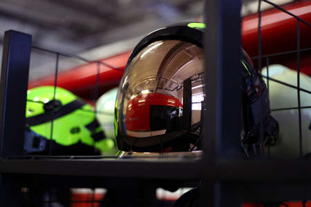Three firefighters extinguish a fire in an apartment house