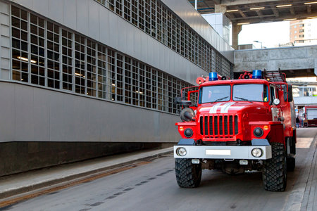 Three firefighters extinguish a fire in an apartment houseの写真素材