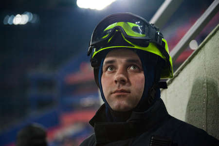 Three firefighters extinguish a fire in an apartment houseの写真素材