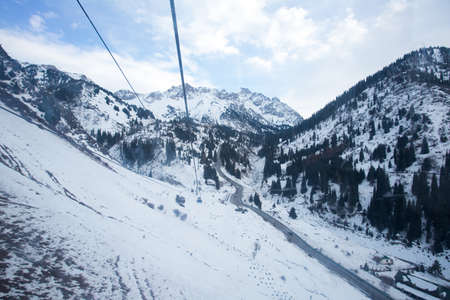 The cable car in the snowy mountains Chimbulak photo for youの写真素材