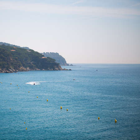 The sea, mountains and buoys photo for you