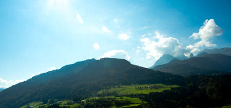 Bright green meadows and blue sky photo for you