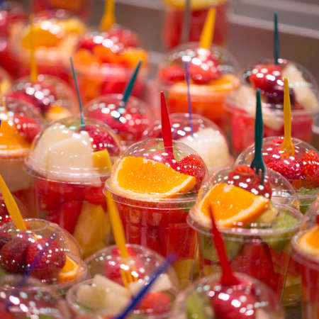 Fruit salad in plastic cups photo for youの写真素材