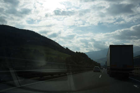 Road, green meadows, blue sky photo for youの写真素材