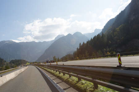 Road, green meadows, blue sky photo for youの写真素材