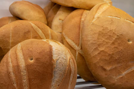 Artisan baker and pastry chef. Detail of breads in a bakery