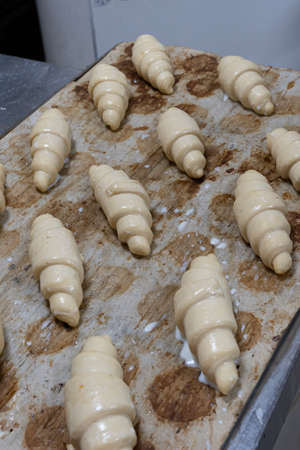 Artisan baker and pastry chef. Detail of chocolate bread pastries in a bakery