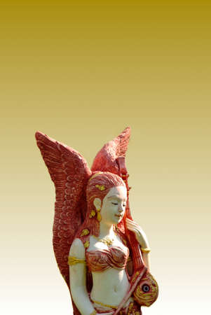 Asian angel statue playing an instrumentの写真素材