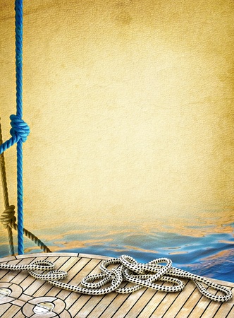 Ship rope on the old paper background  Sailboat ropes and wooden deck of the sea - vintage textured background  Marine design frame with elements of yachting の写真素材